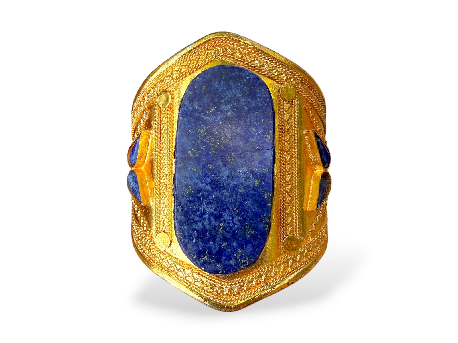 An Afghan Gold Plated Patterned Open Cuff With A Lapis Lazuli Oval Panel At The Centre, And Six Small Lapis Lazuli Inlays
