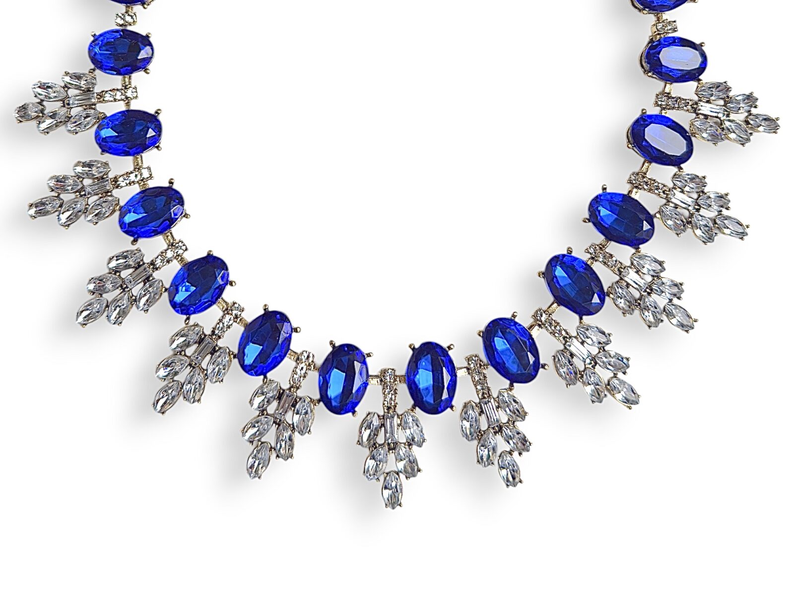 A Golden Metal Necklace With Blue And Clear Facetted Resin Cabochons. - Image 2