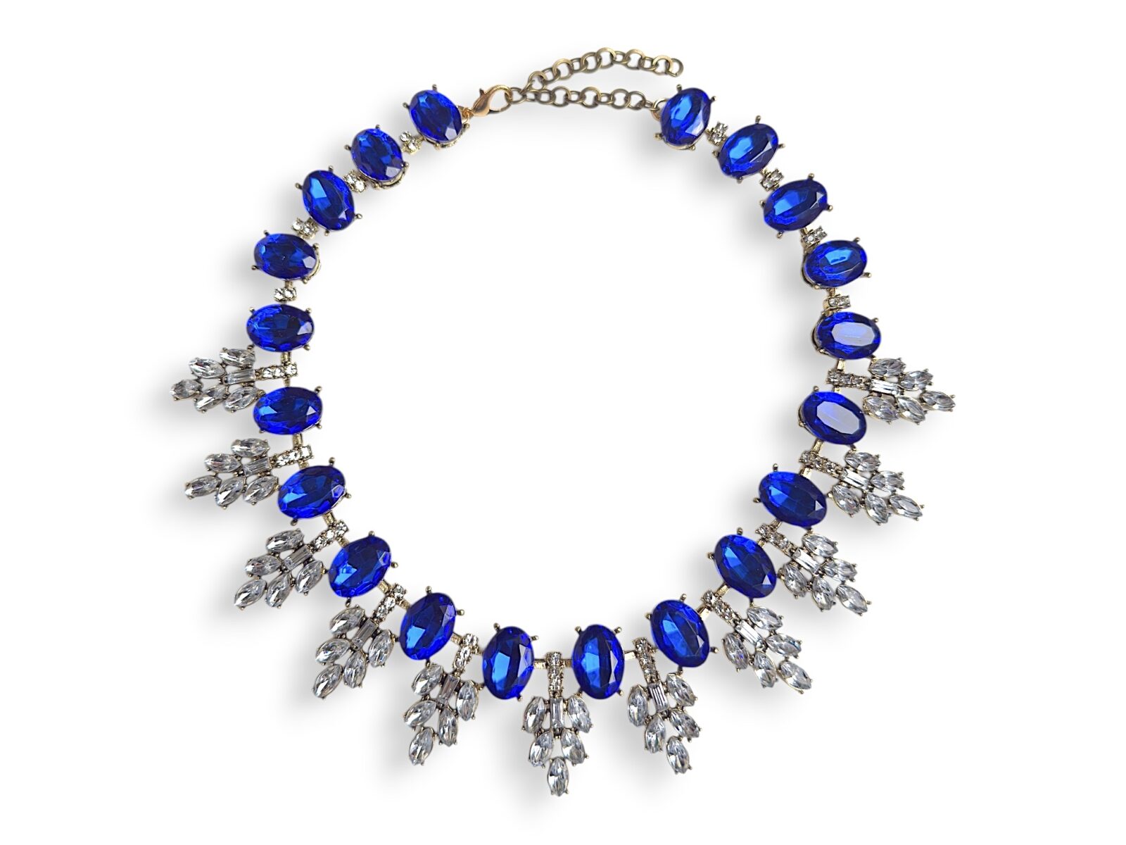 A Golden Metal Necklace With Blue And Clear Facetted Resin Cabochons.