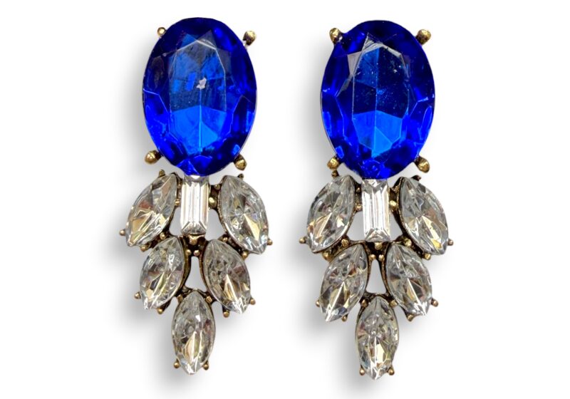 A Pair Of Golden Metal Earrings With Blue And Clear Facetted Resin Cabochons.