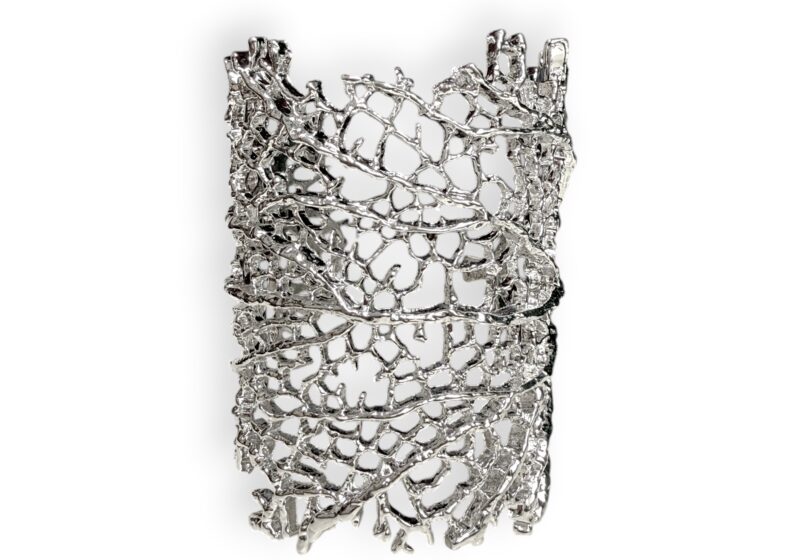A Long Open Cuff With A Silvered Metal Band Of Skeleton Leaves.