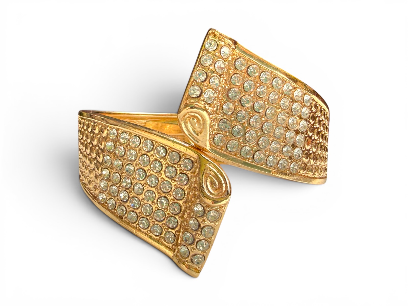 A Hinged Golden Metal Cuff Of Two Tapered Bands Inlaid With Clear Facetted Glass Cabochons