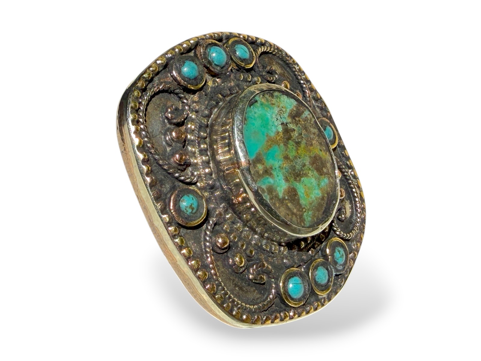 A Tibetan Silver And Golden Metal Large Rectangular Patterned Top Ring Inlaid With One Large And Eight Small Turquoise Cabochons. - Image 2