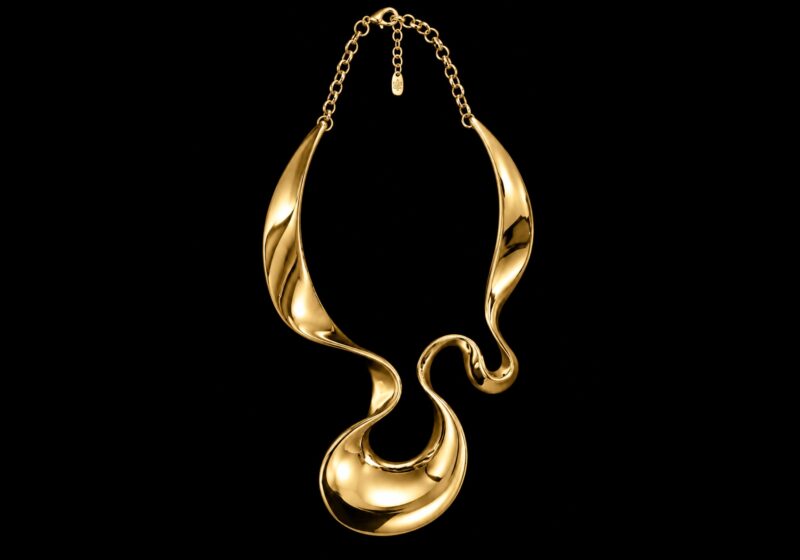 A Golden Metal Large Coiled And Curved Wide Tapered Band, On A Golden Metal Chain Necklace.