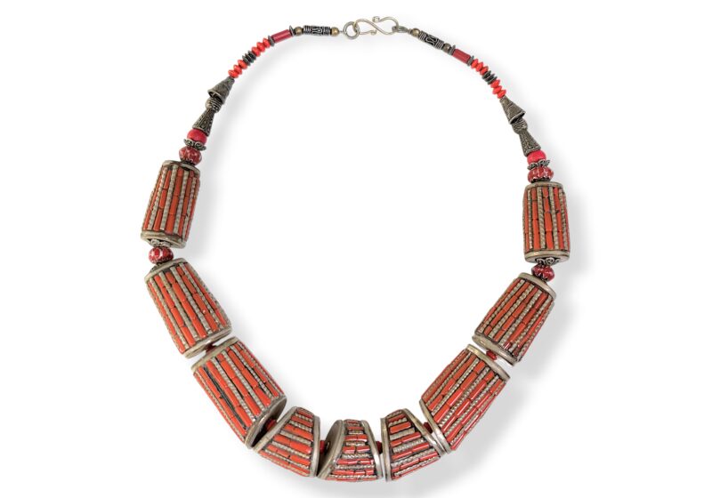 A Nepalese Necklace Of Silver Plated Mixed Shaped And Sized Beads, Each Inlaid With Orange Coral Tubular Beads