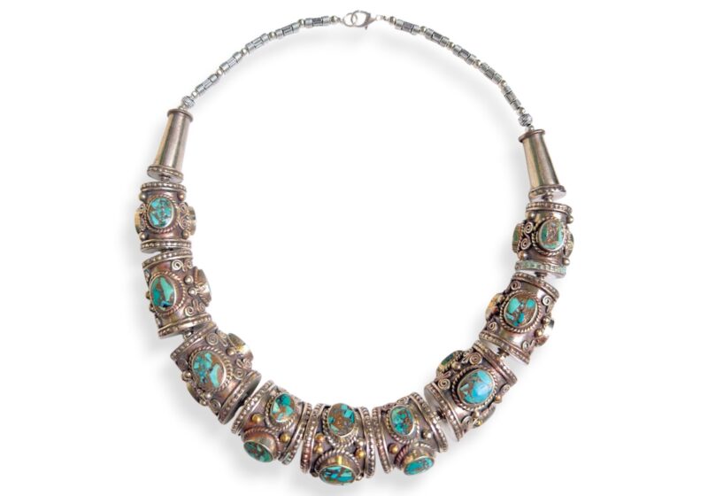 A Nepalese Necklace Of Nine Silver Plated Patterned Barrel Beads , Each Inlaid With Turquoise Cabochons.