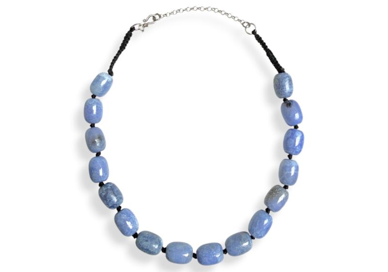 One Black Cotton Bands Knotted Necklace With Sixteen Chalcedony Barrel Beads.