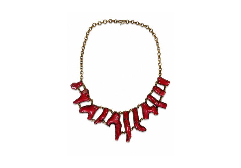 A Golden Metal Chain Necklace With Linked Red Dyed Sea Bamboo Coral Irregular Shaped Branches, Each Set In A Golden Metal Frame.