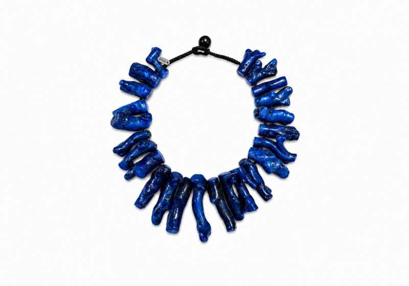 A Black Cotton Braided Cord Knotted Necklace With Twenty-Four, Graduated Drops Of Dark Blue Dyed Chinese Sea Bamboo Coral Branches.