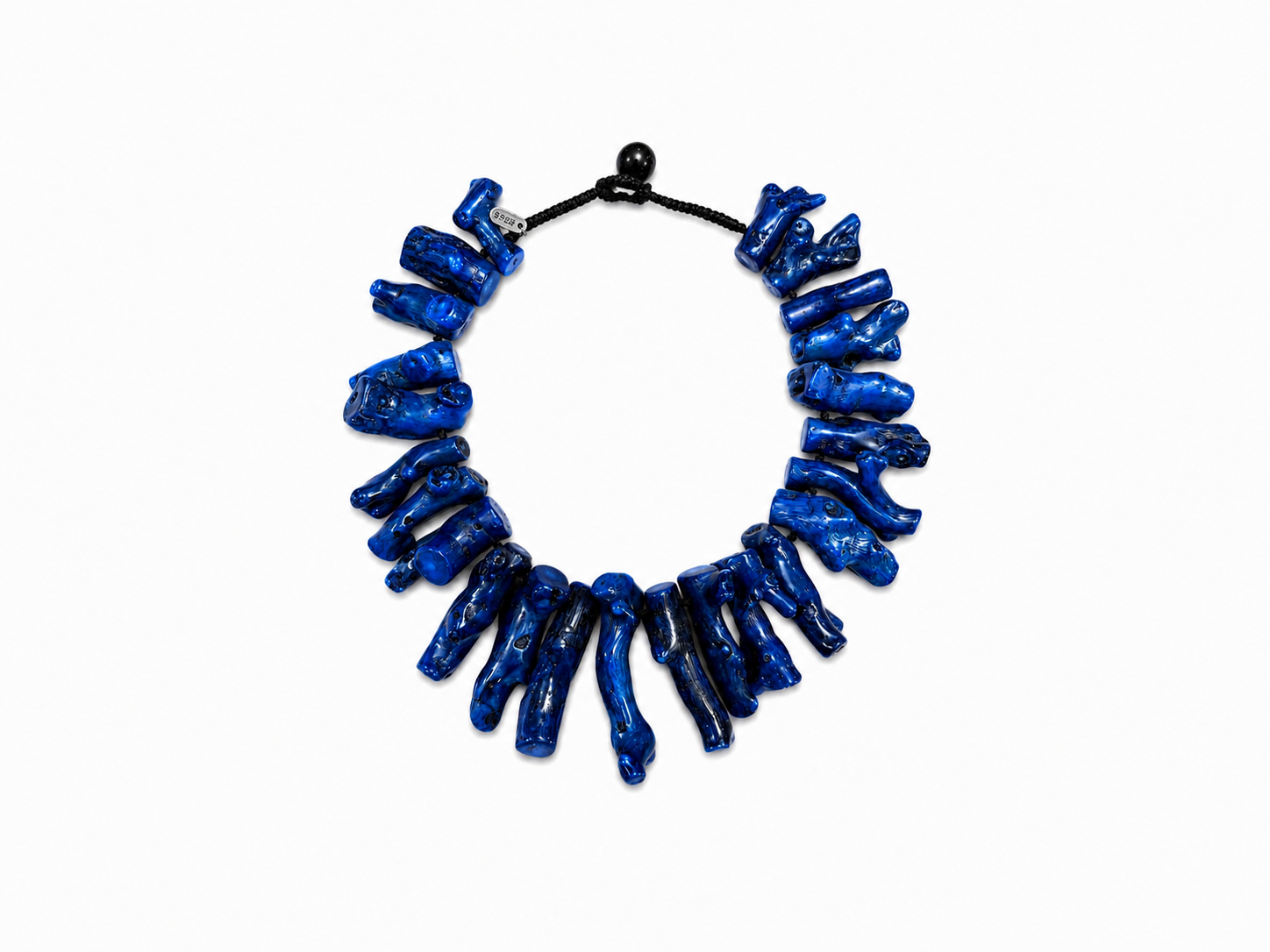 A Black Cotton Braided Cord Knotted Necklace With Twenty-Four, Graduated Drops Of Dark Blue Dyed Chinese Sea Bamboo Coral Branches.