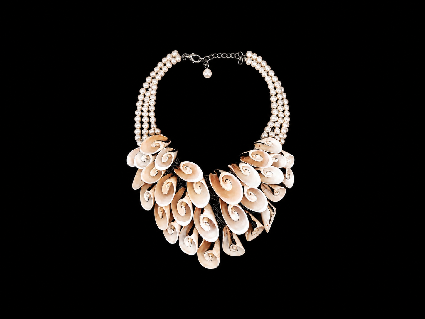 A Four Strand Necklace Of White Freshwater Pearls, And A Curved Tapered Three Row Panel Of Curved And Coiled Light Brown Shell Oval Slices.