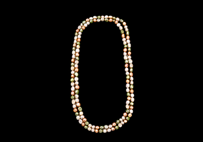 A Long Knotted Necklace Of White Freshwater Pearls, And Light Green And Orange Dyed Freshwater Pearls