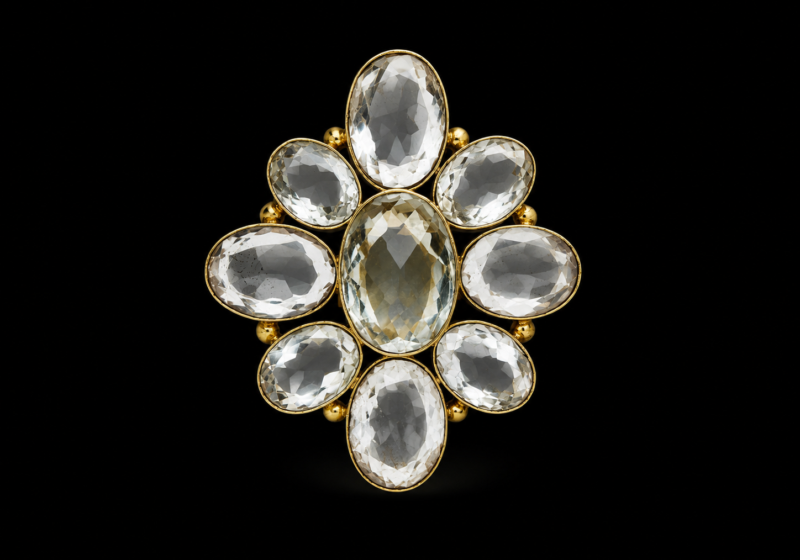 A Large Gold Plated Flower Shaped Ring With Nine Facetted Rock Crystal Domed Oval Cabochons, Each Set In A Gold Plated Frame.