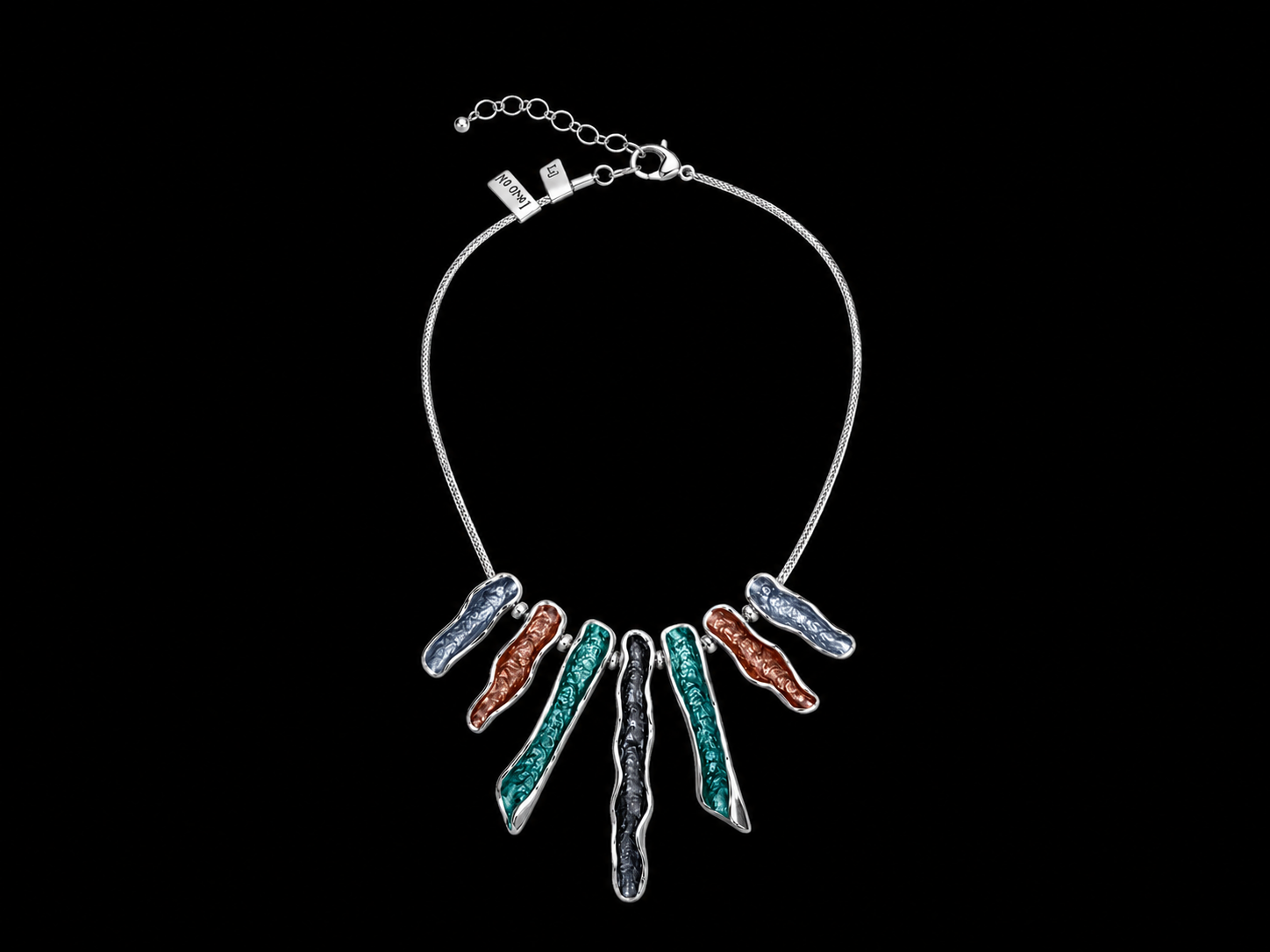 A Silvered Metal Chain Necklace With Seven Graduated Length, Enamel Painted Patterned Pendants, In Four Different Colours.