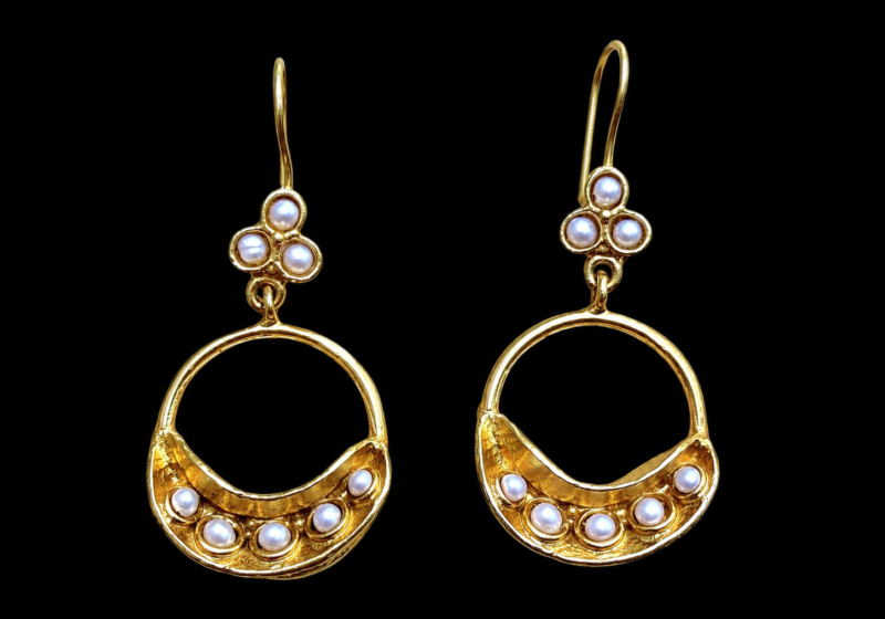 A Pair Of Gold Plated Star Fruit Curved Ridged Bands Earrings, Inlaid With White Freshwater Pearls, On A Gold Plated Wire Hook.