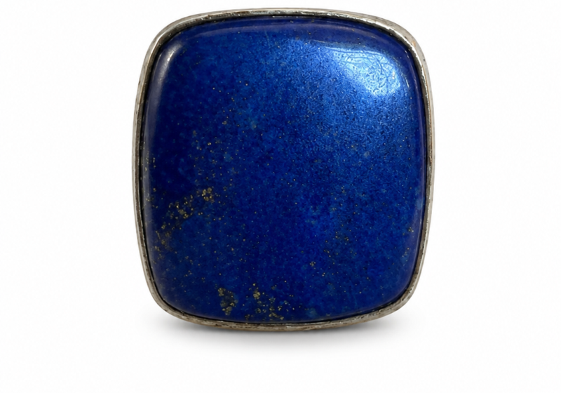 A Silver Ring With A Rectangular Shaped Top Inlaid With A Lapis Lazuli Domed Rectangular Shaped Panel With Curved Borders.