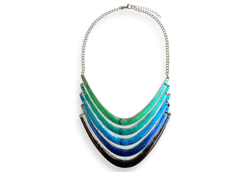 A Silvered Metal Chain Necklace With Five Curved Tapered Linked Bars, Each Bar Enamel Painted In A Different Colour.