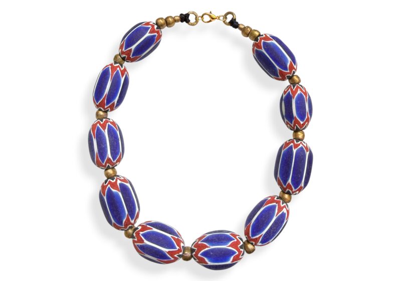 A Long Necklace Of Ten Blue, Red, And White Patterned Glass Chevron Barrel Beads With Brass Spacer Beads.