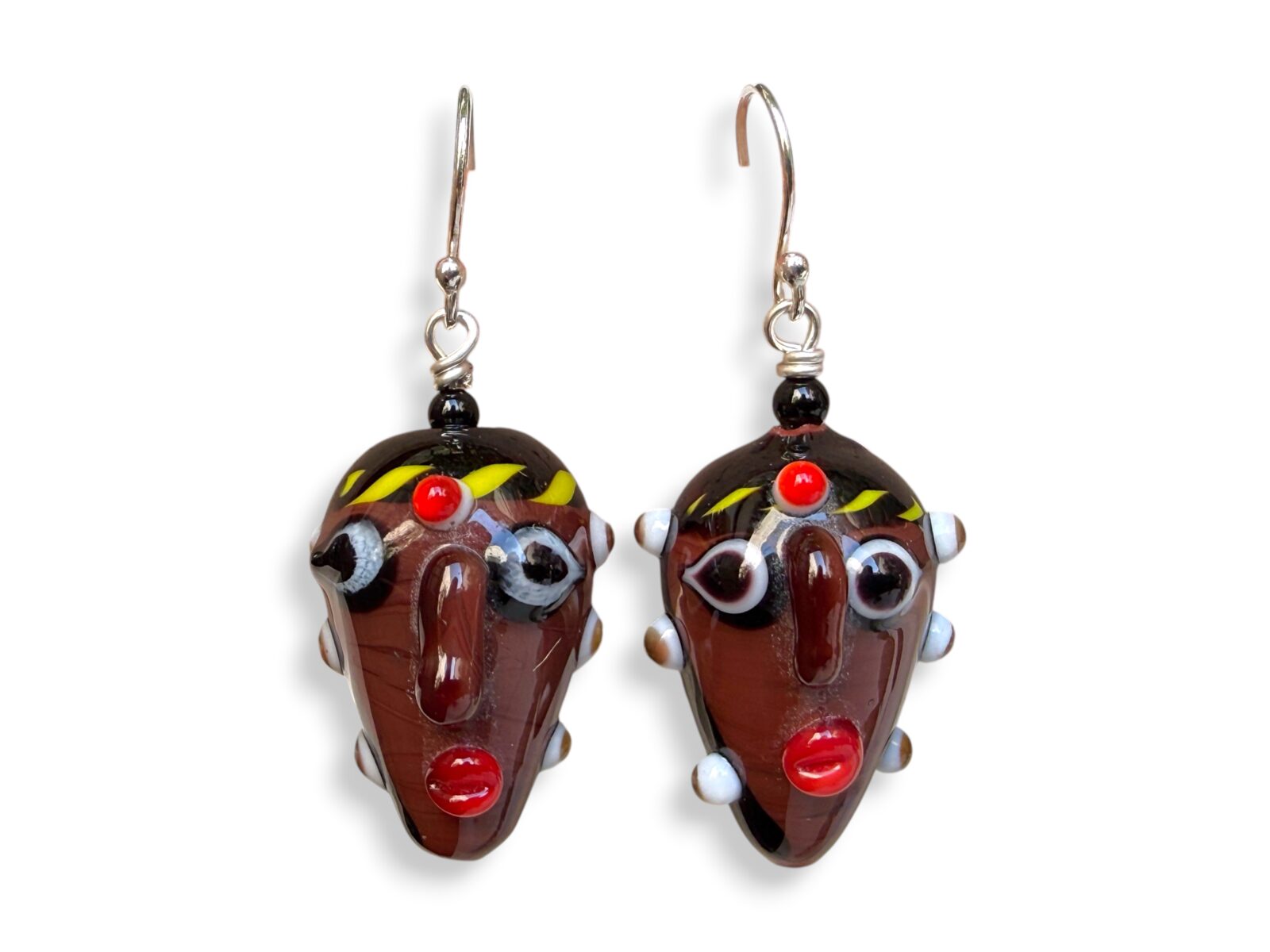 A Pair Of Javanese Two Faces Multicoloured Glass Bead Earrings. Indonesia.
