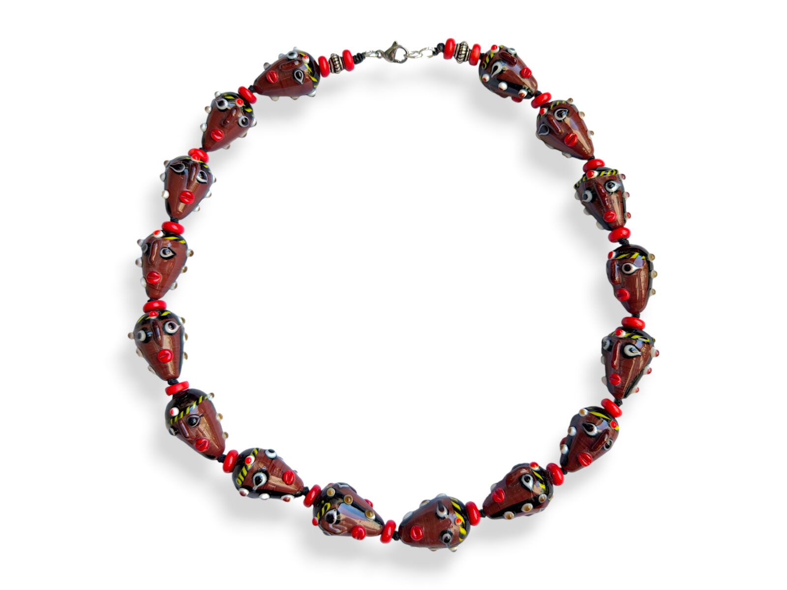 A Knotted Necklace Of Sixteen Javanese Glass Two Faces Beads With Red Glass Circular Spacers. Indonesia.
