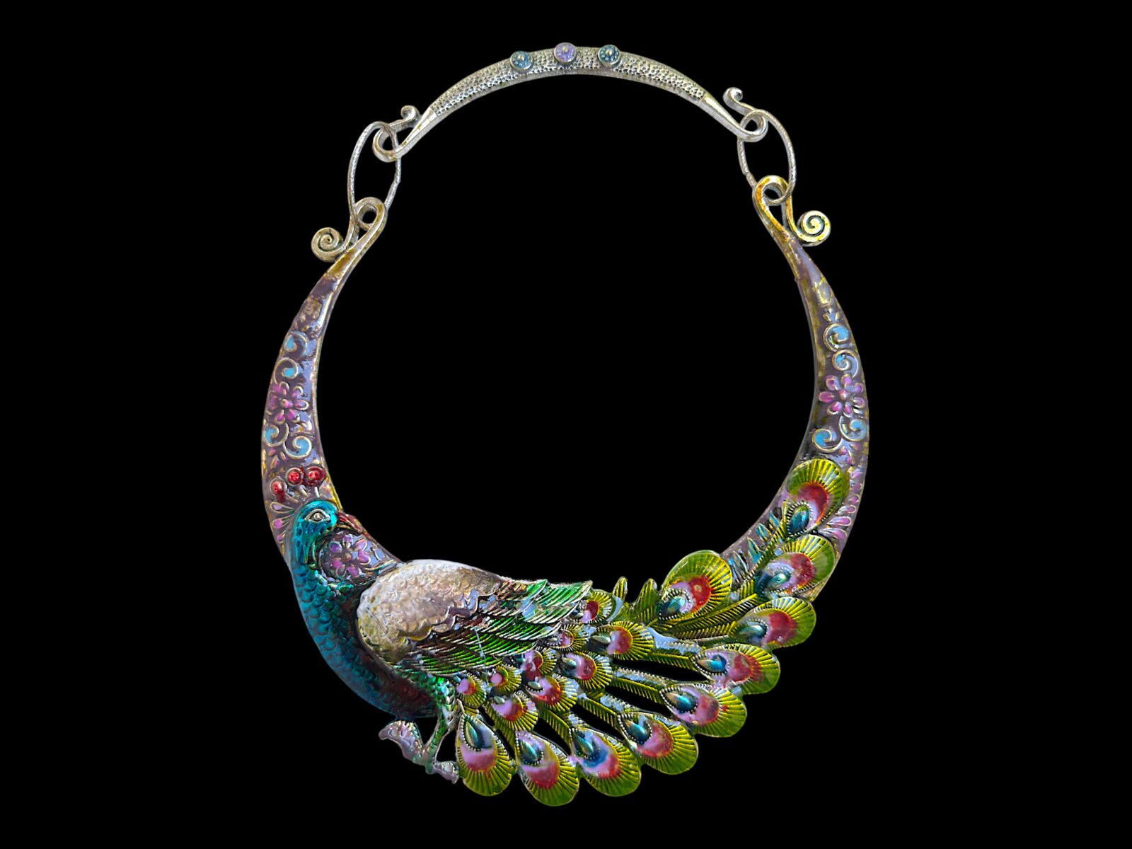 A Silvered Metal Curved Tapered Band Necklace Of A Multicoloured Painted Peacock.