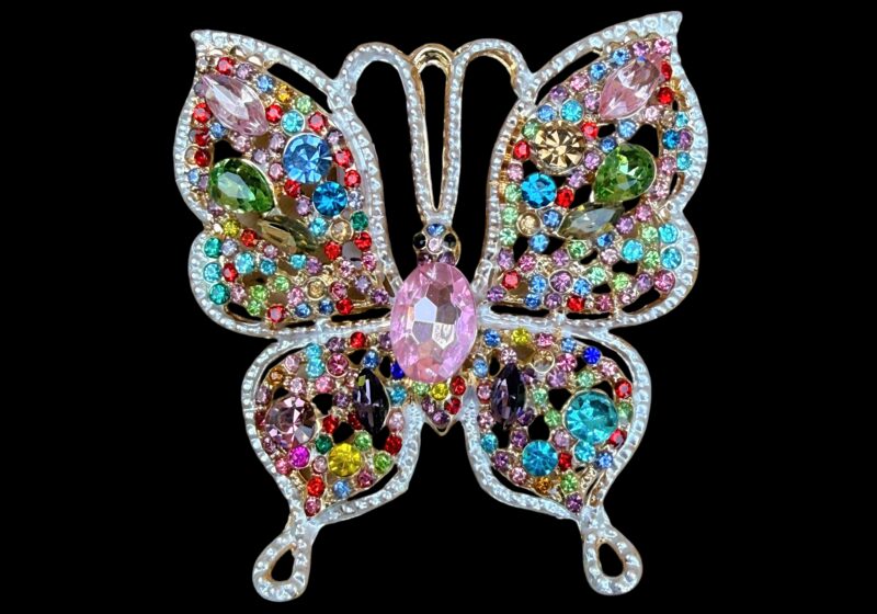 A Golden Metal Butterfly Brooch Inlaid With Multicoloured Facetted Glass Cabochons.