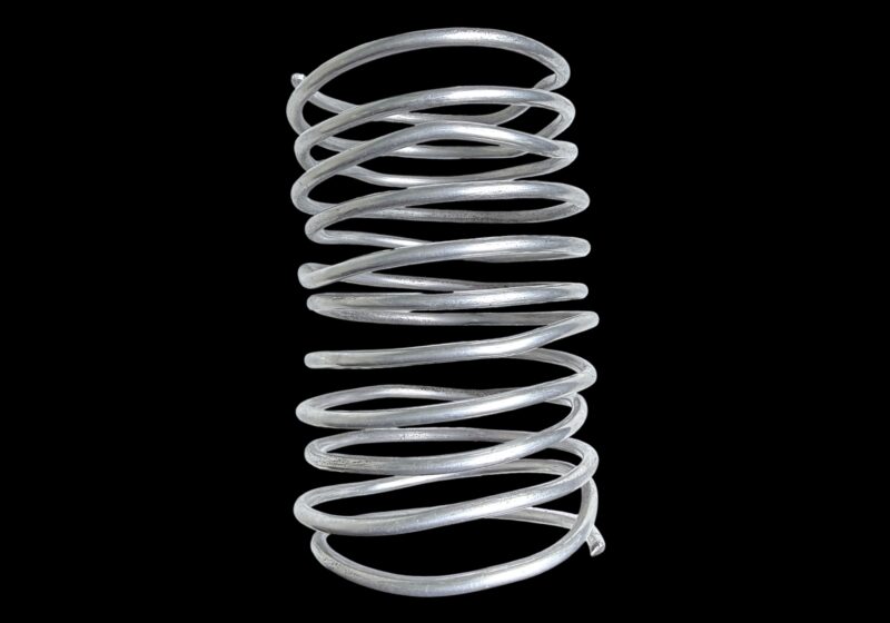 An Ethiopian Silvered Metal Coiled Bangle With Twelve Coils