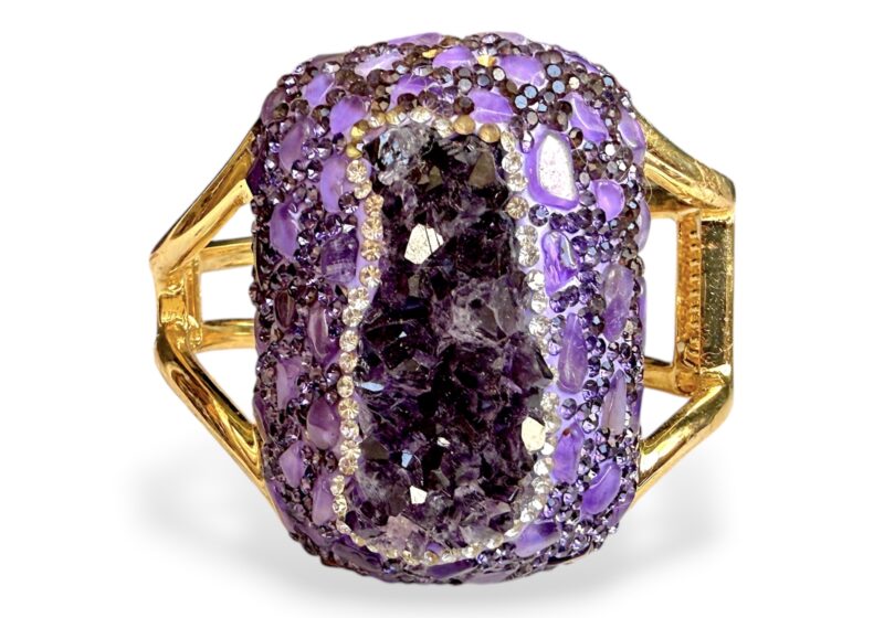 A Golden MetalTwo Band Hinged Bangle With A Large Domed Rectangular Panel, Inlaid With Amethyst Crystals.