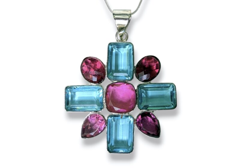 Silver Plated Floral Cross Shaped Pendant With Blue And Pink Facetted Crystal Cabochons