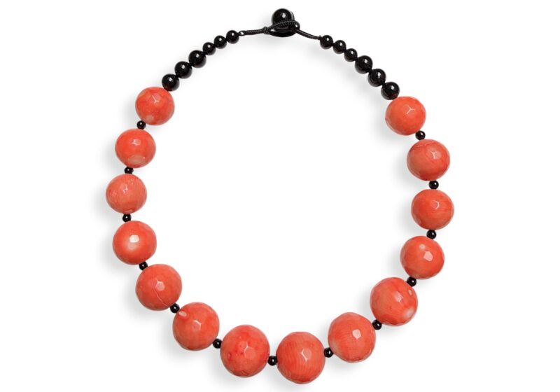 A Necklace Of Orange Dyed Sea Bamboo Coral Facetted Round Beads And Black Onyx Spacer Beads.