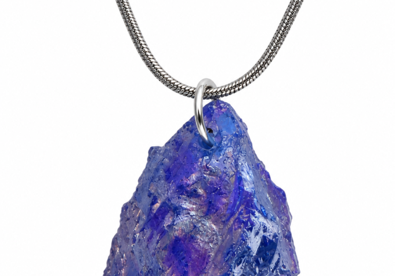 A Dark Blue Iridescent Glass Nugget pendant On A Long Silvered Metal Chain Necklace.