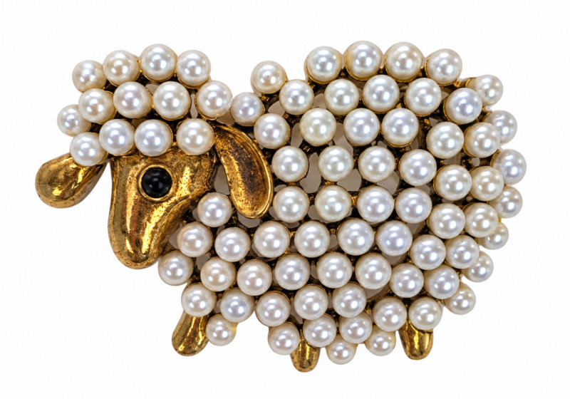 A Golden metal brooch of a sheep inlaid with small round white glass "faux pearls".