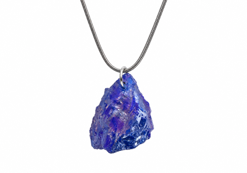 A Dark Blue Iridescent Glass Nugget pendant On A Long Silvered Metal Chain Necklace.