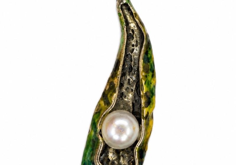 A Green Enamelled Silvered Metal Pendant Of A Leaf With A White Round Glass 'Faux Pearl'.