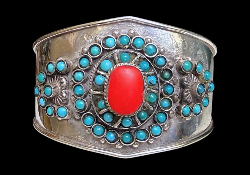 An Afghan Silver Plated  Bangle Inlaid With Small Turquoise Round Beads  And A Cornelian Cabochon.