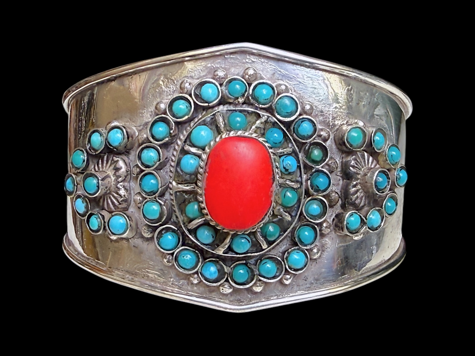 An Afghan Silver Plated Bangle Inlaid With Small Turquoise Round Beads And A Cornelian Cabochon.