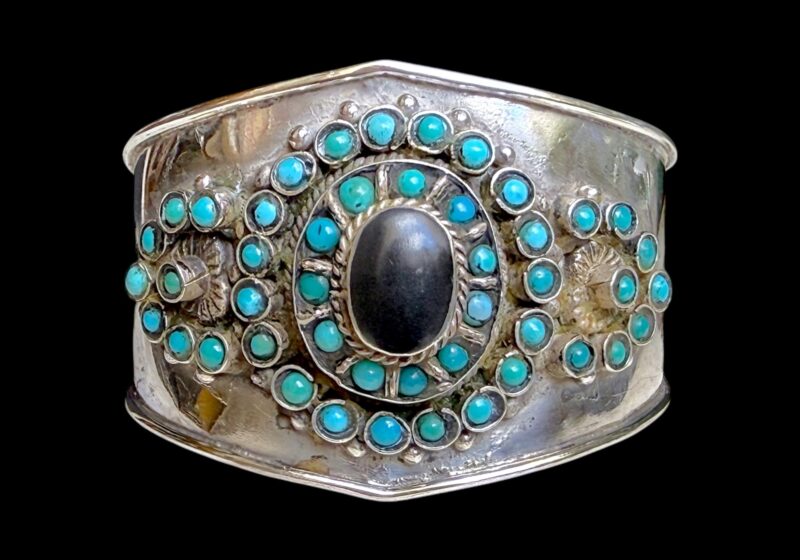 An Afghan Silver Metal Open Cuff Inlaid With Small Round Turquoise Beads And A Black Onyx Domed Oval Cabochon.