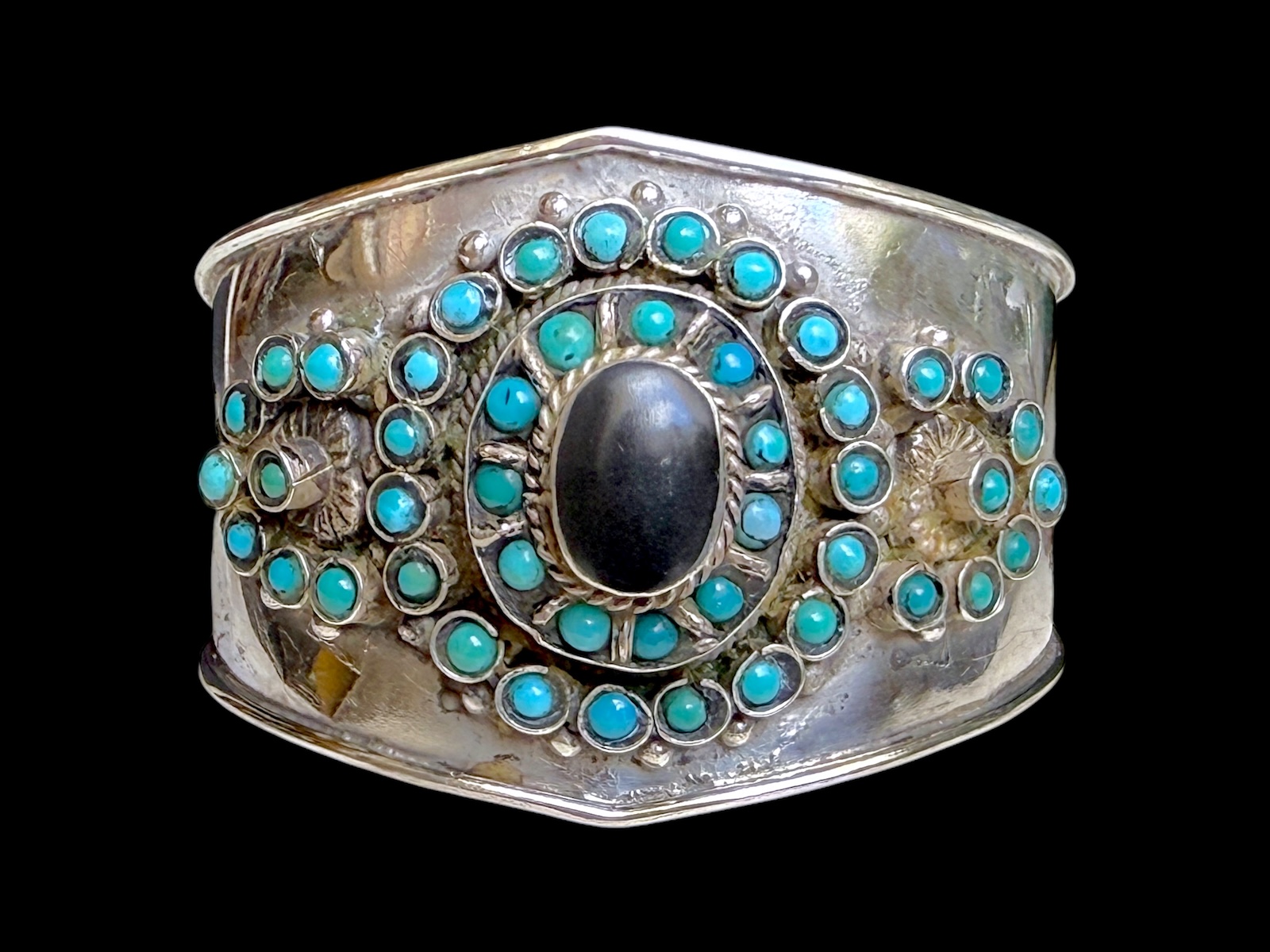 An Afghan Silver Metal Open Cuff Inlaid With Small Round Turquoise Beads And A Black Onyx Domed Oval Cabochon.