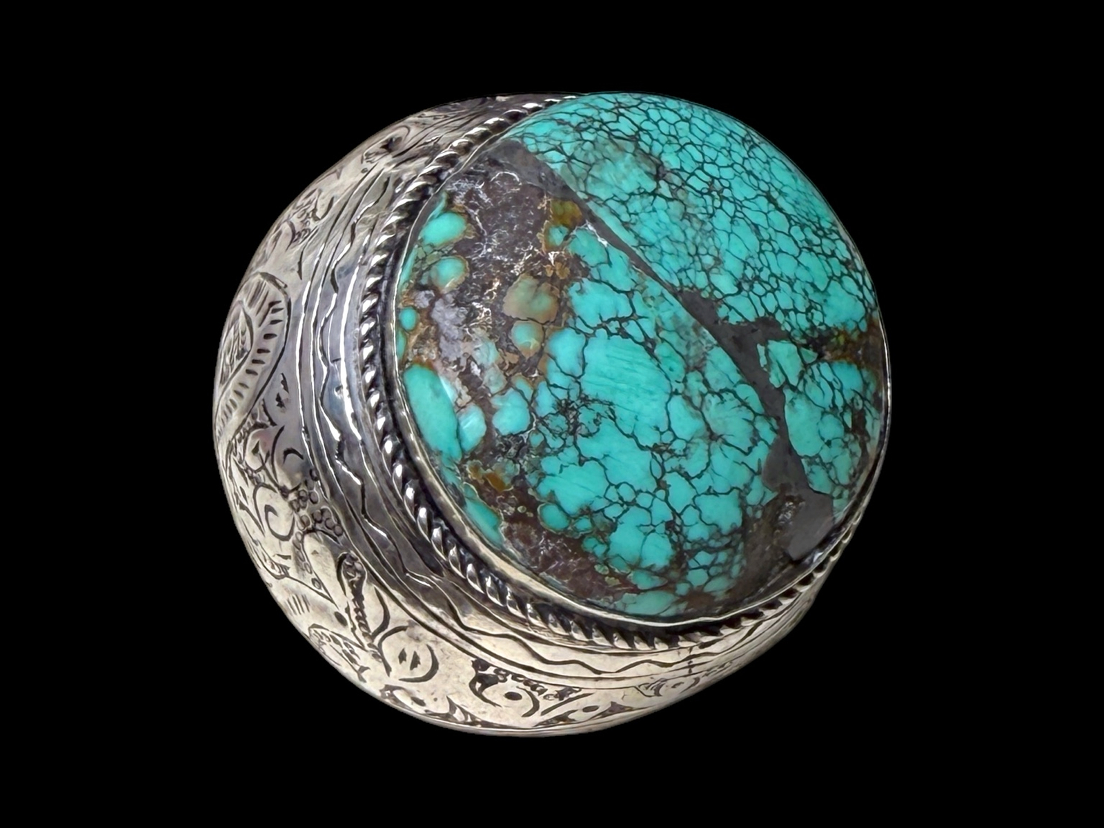 A Large Late Nineteenth Century Afghan Silver Wide Patterned Band Ring Inlaid With A Large Circular Turquoise Cabochon.